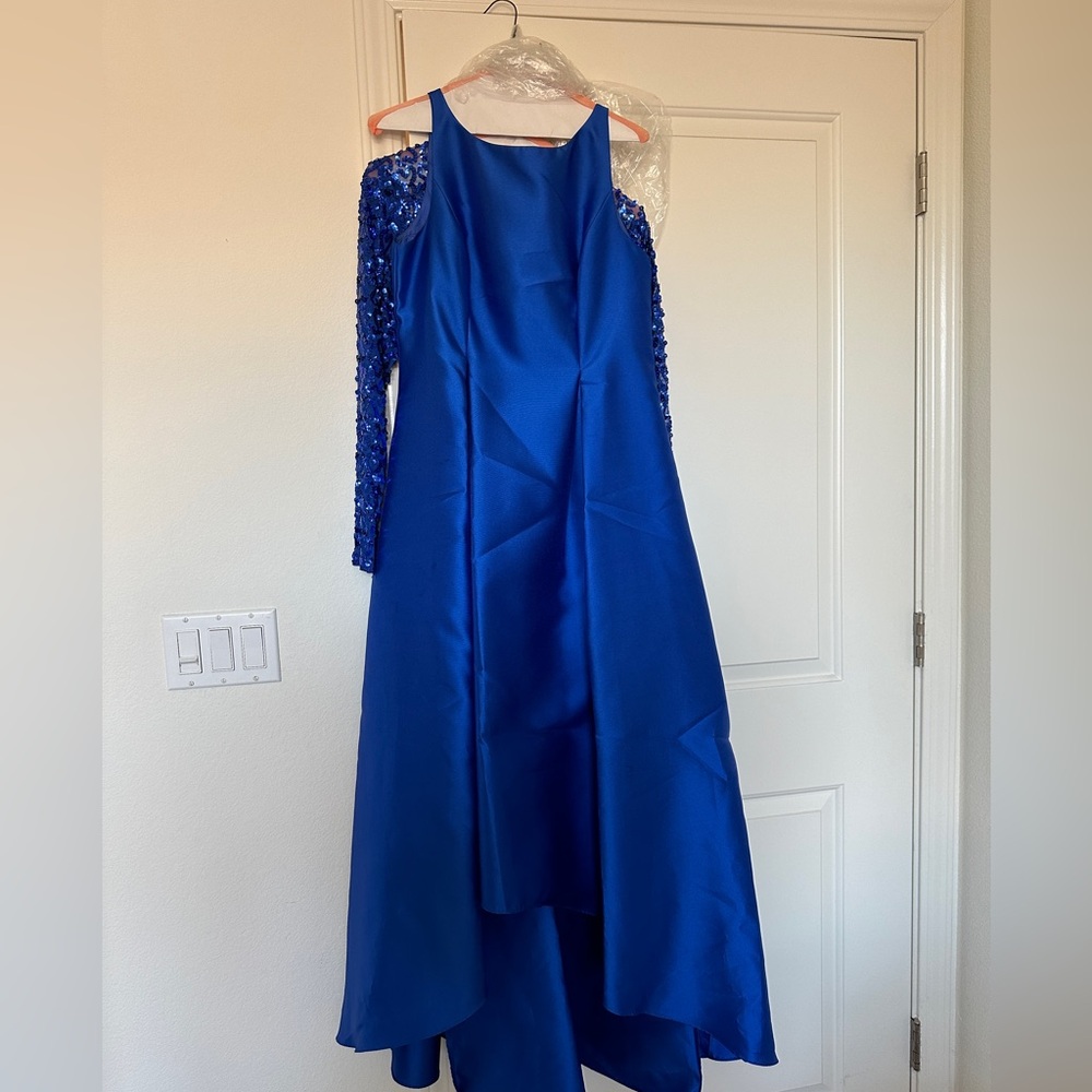 Only worn once for an evening wedding. Sequin bolero included.